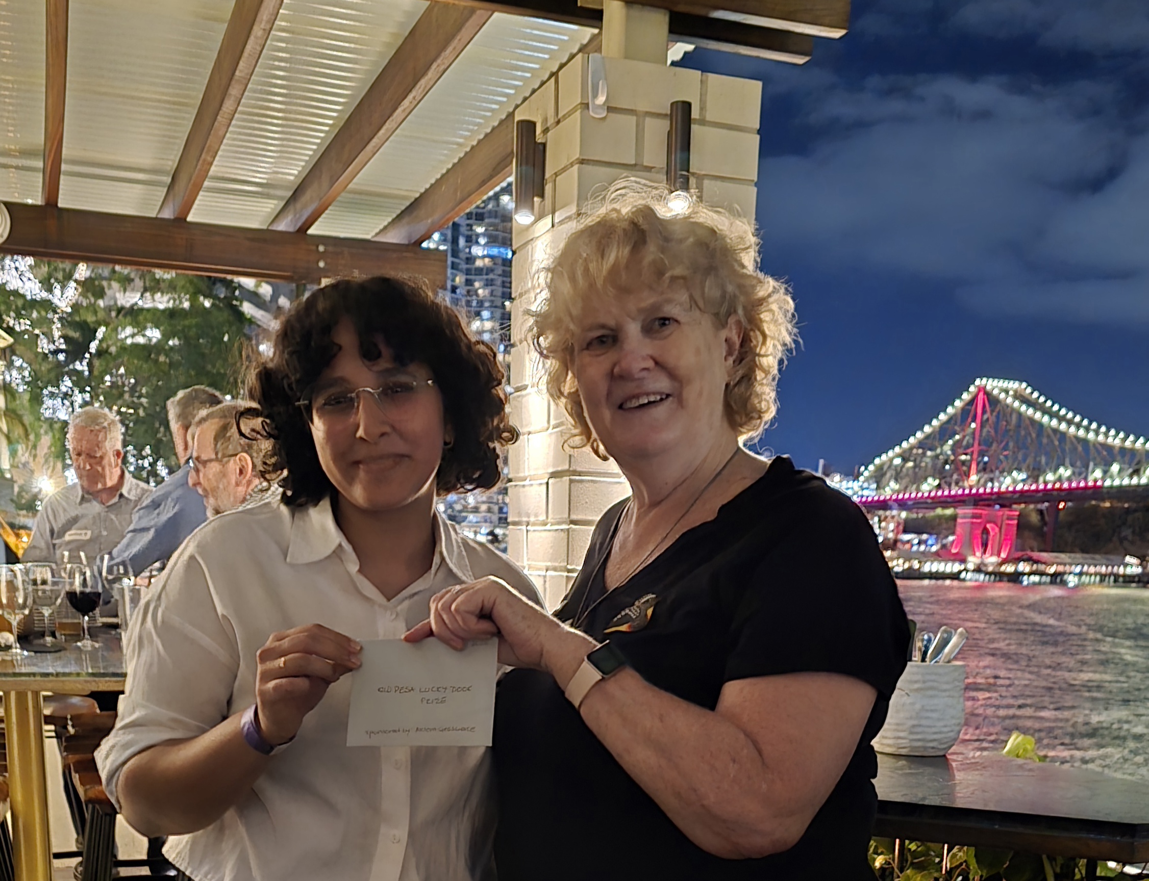PESA Queensland President Sue Slater and lucky door winner Ariga Agrawal